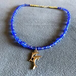 Blue beaded with gold dolphin charm necklace